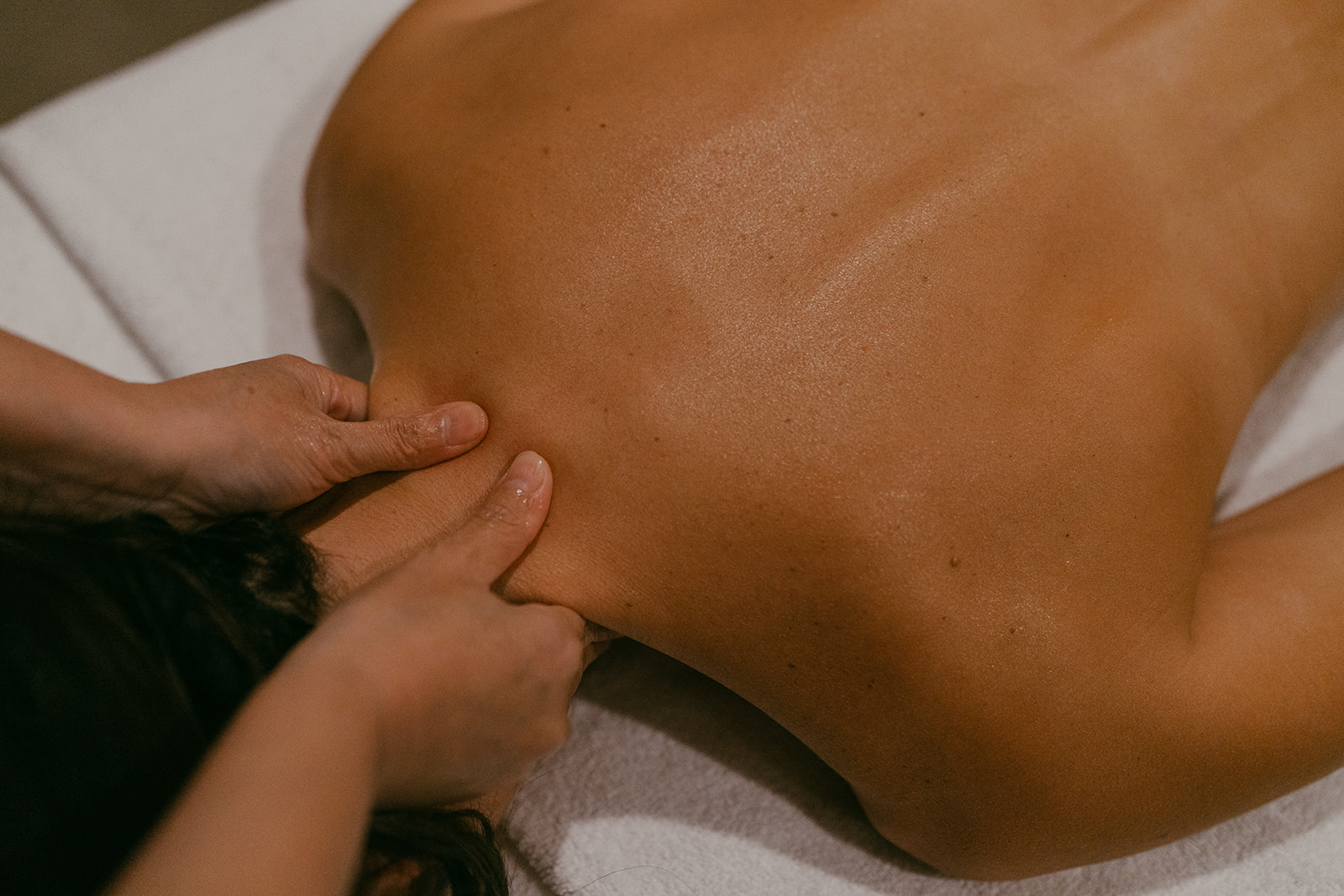 Sanctuary Day Spa Close-up of hands giving a deep tissue massage at Sanctuary Day Spa, Wanaka
